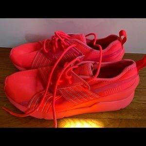 Brand new, no tags Puma bright orange sneakers,